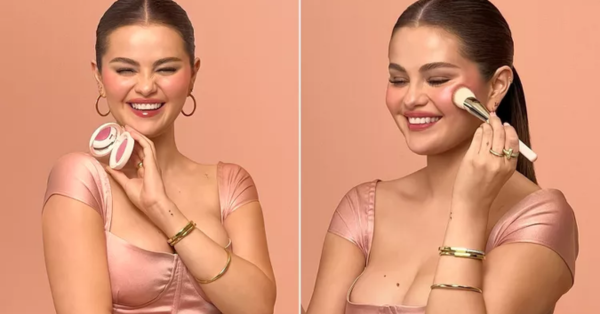 Selena Gomez in pink corset top applying Rare Beauty luminous powder blush