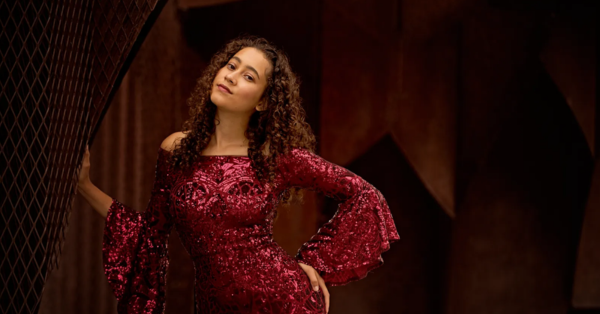 Actor Bryanna Cuthill posing in a red sequin dress